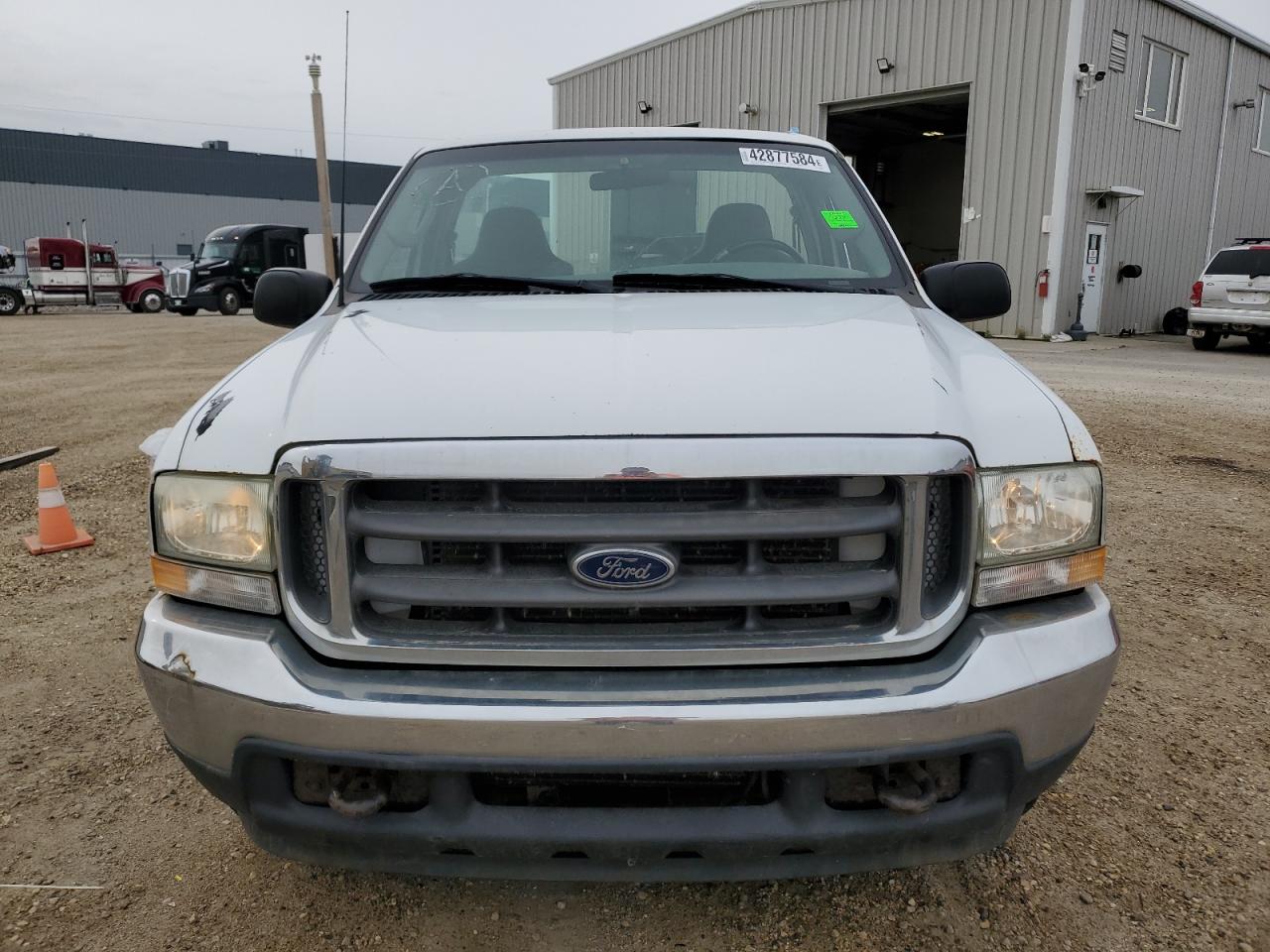 2003 Ford F250 VIN 1FTNF20L33EC33209 Copart auction photo, vandalism / side damage thumbnail 5