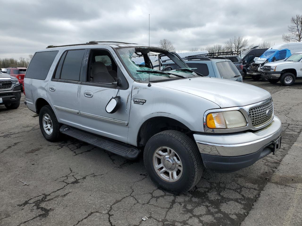 1999 Ford Expedition VIN 1FMRU1860XLB25790 Copart auction photo, rollover damage thumbnail 4