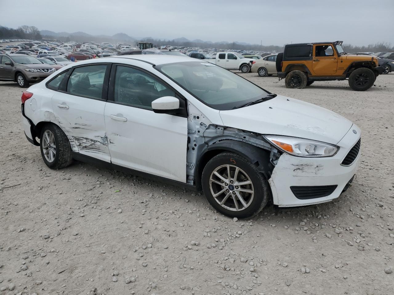 2018 Ford Focus VIN 1FADP3F23JL218432 Copart auction photo, all over / undercarriage damage thumbnail 4