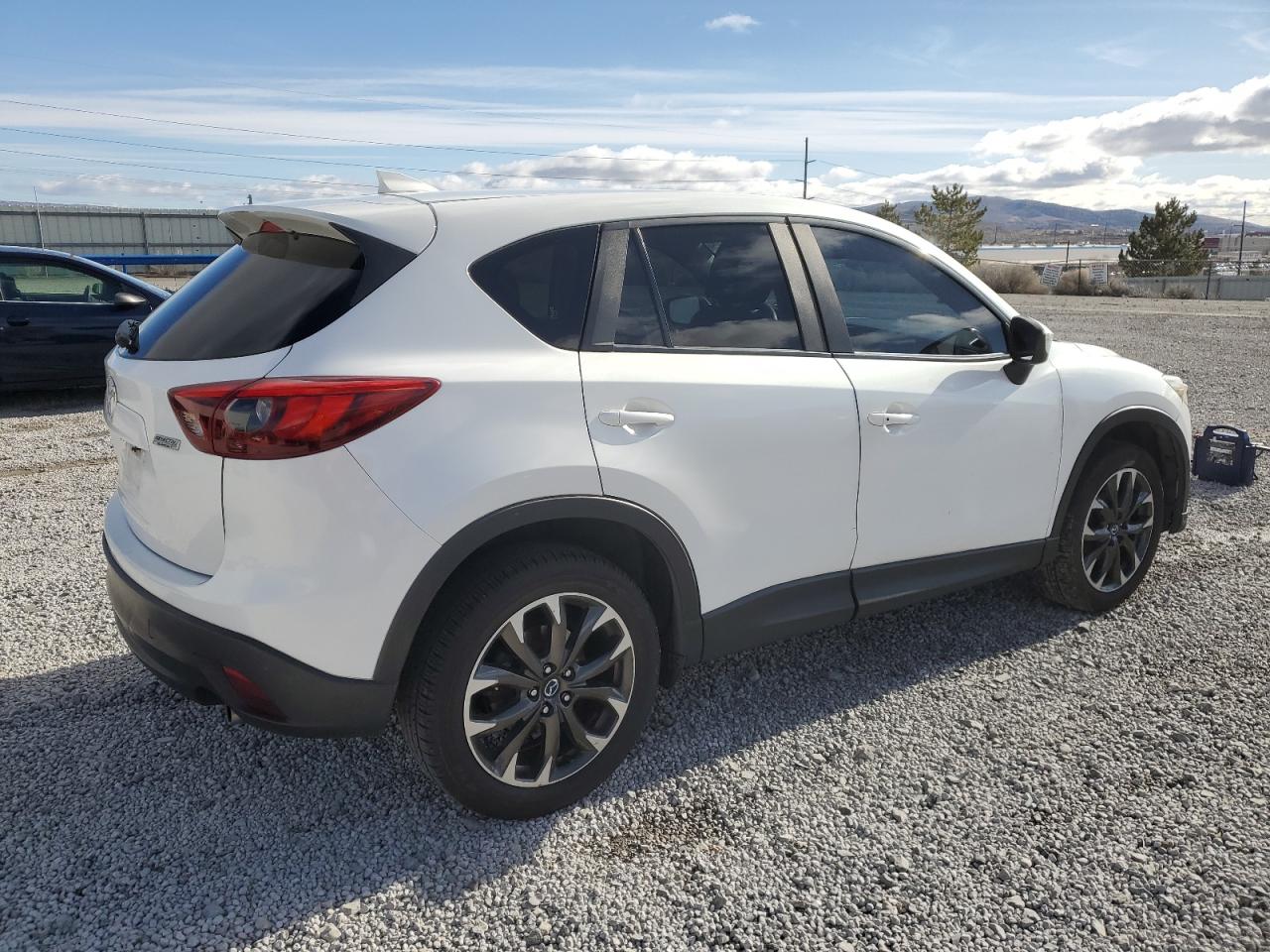2016 Mazda CX-5 VIN JM3KE4DY3G0672069 Copart auction photo, side / front end damage thumbnail 3