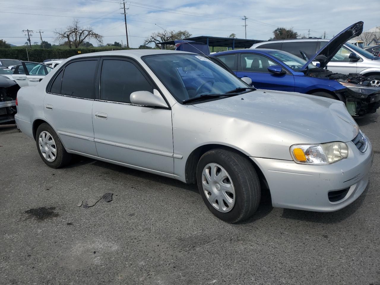 2001 Toyota Corolla VIN 1NXBR12E31Z428258 Copart auction photo, front end / side damage thumbnail 4