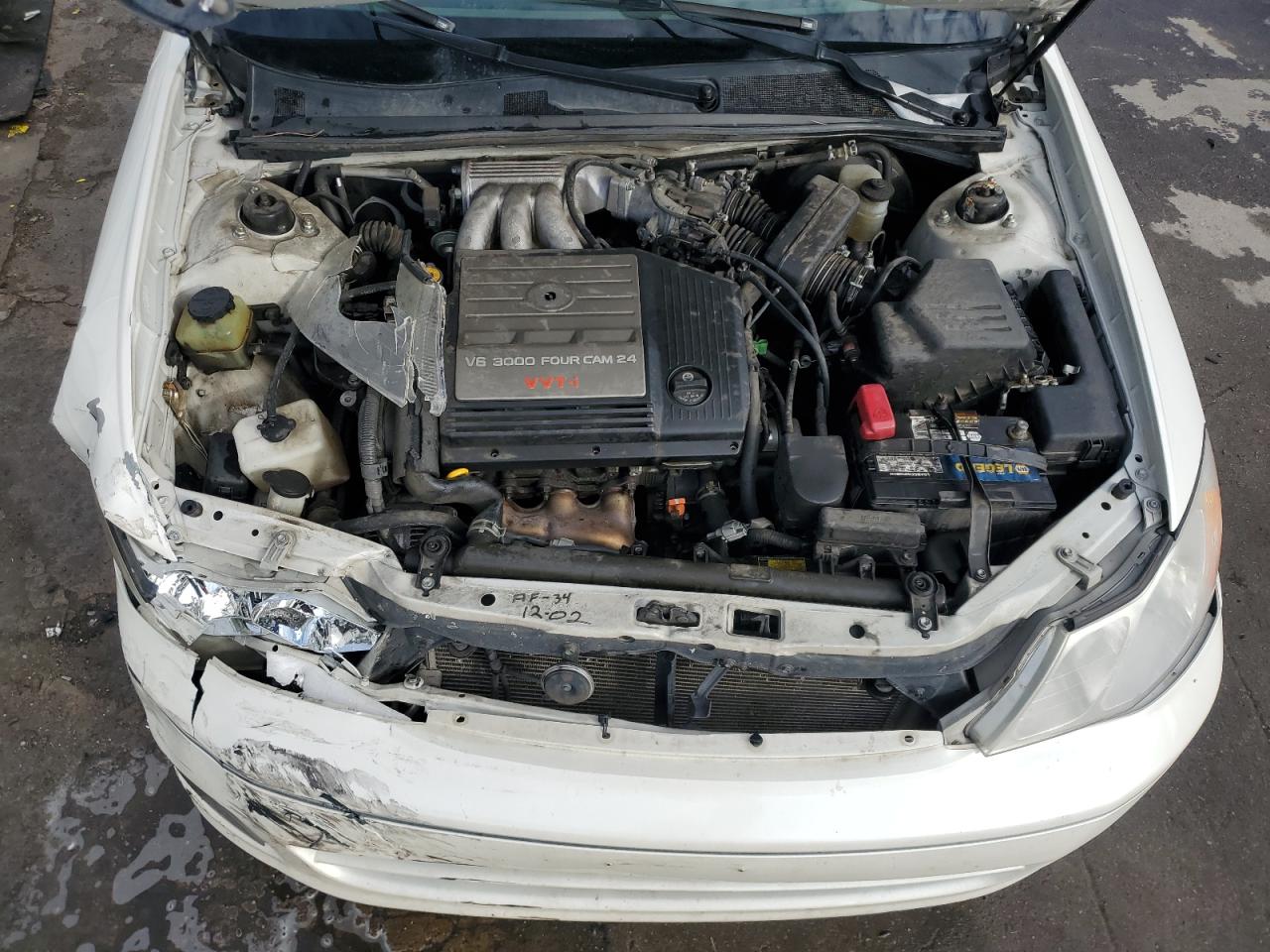 2000 Toyota Avalon VIN 4T1BF28B2YU098375 Copart auction photo, front end / hail damage thumbnail 11