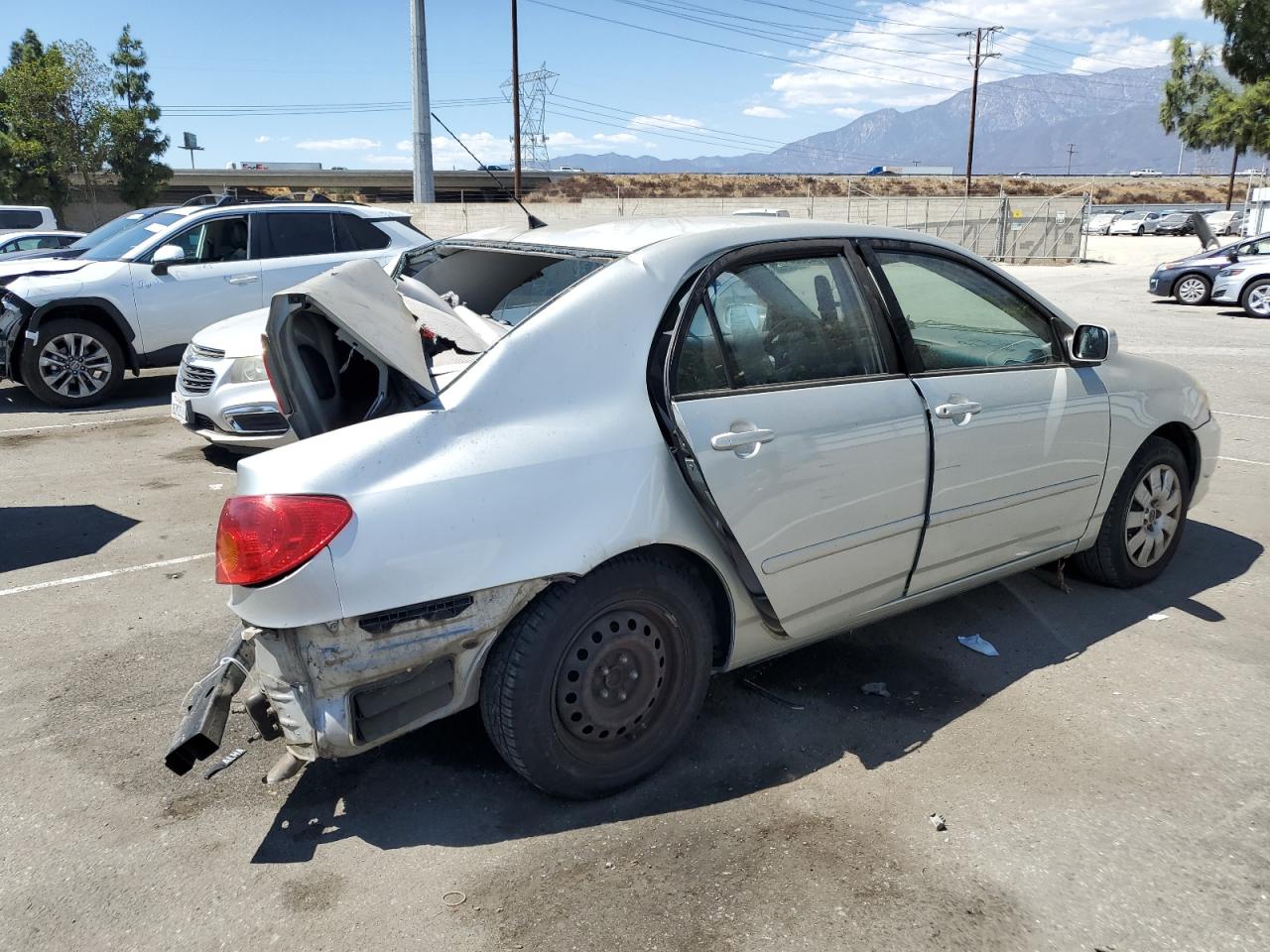 2003 Toyota Corolla VIN 1NXBR32E73Z053618 Copart auction photo, rear end damage thumbnail 3
