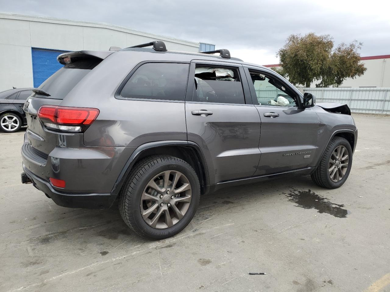 2016 Jeep Grand Cherokee VIN 1C4RJFBG5GC385968 Copart auction photo, front end / side damage thumbnail 3