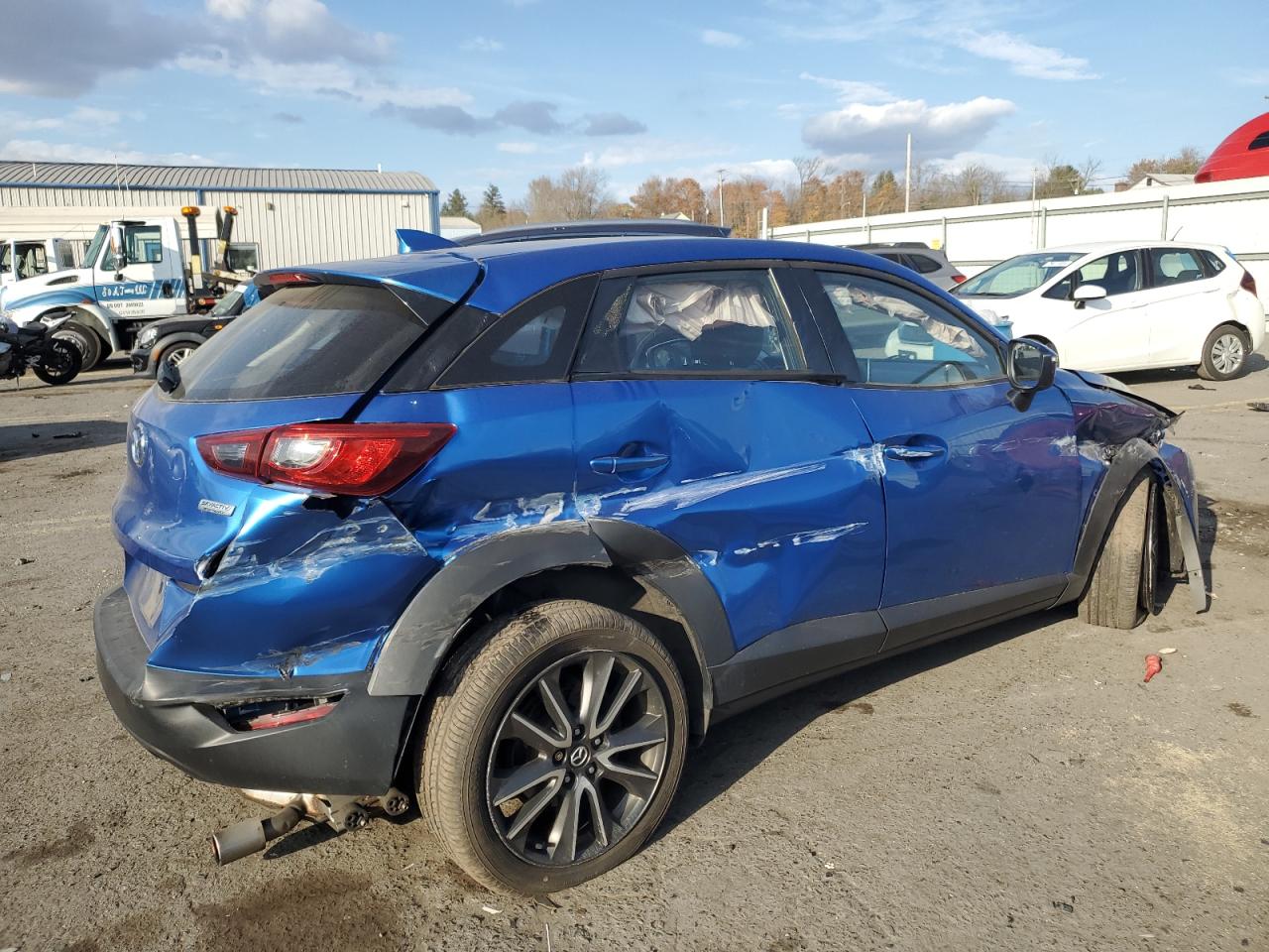 2017 Mazda CX-3 VIN JM1DKFC79H0167847 Copart auction photo, side / front end damage thumbnail 3