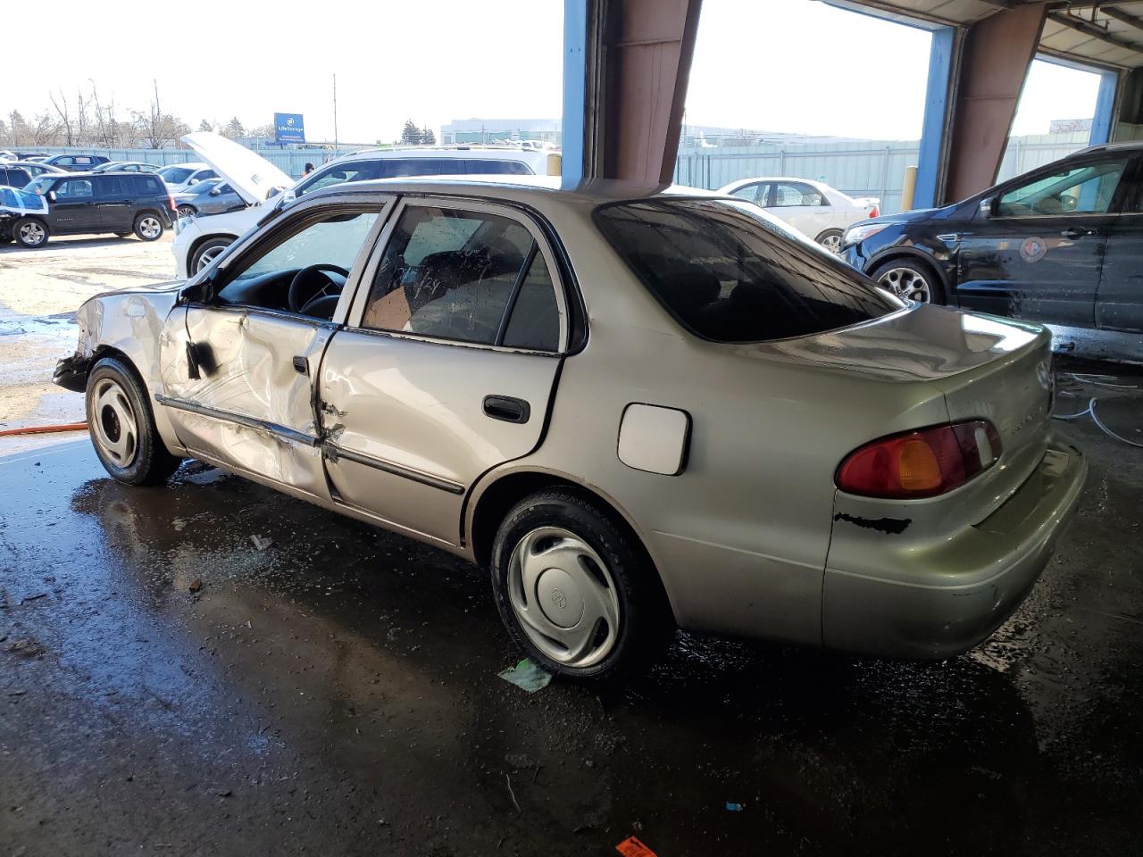 2000 Toyota Corolla VIN 1NXBR12E2YZ319171 Copart auction photo, side / all over damage thumbnail 2