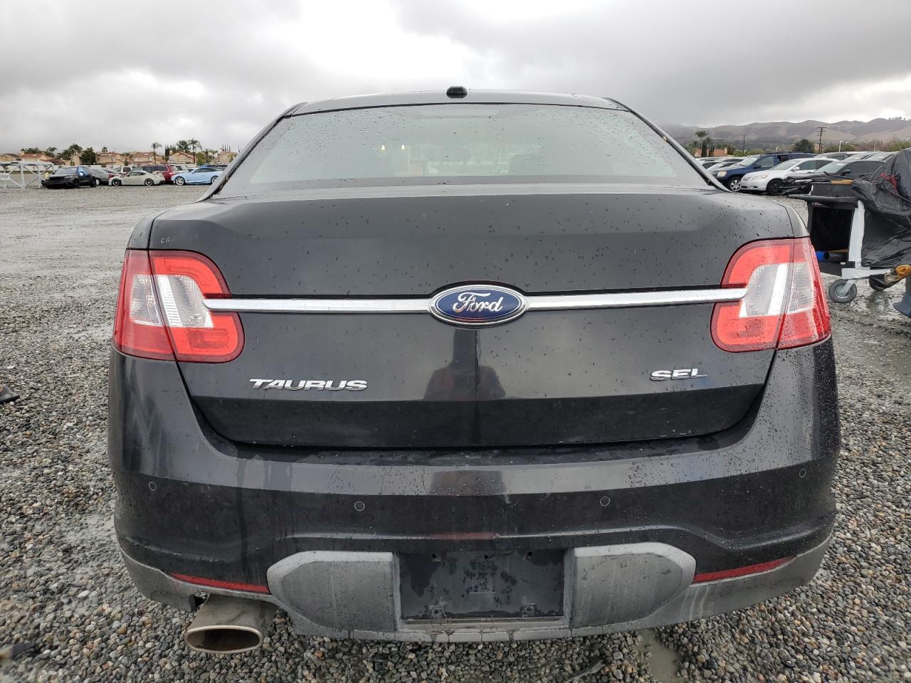 2010 Ford Taurus VIN 1FAHP2EW4AG137285 Copart auction photo, vandalism damage thumbnail 6