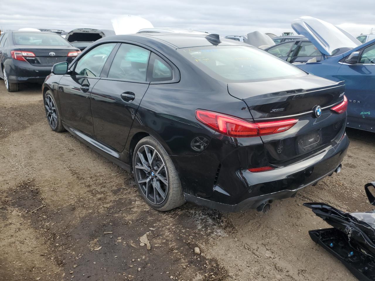 2020 BMW 2er VIN WBA73AK08L7F74933 Copart auction photo, side / minor dent/scratches damage thumbnail 2