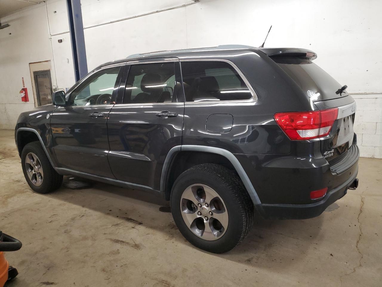 2011 Jeep Grand Cherokee VIN 1J4RR4GG2BC705577 Copart auction photo, side / hail damage thumbnail 2
