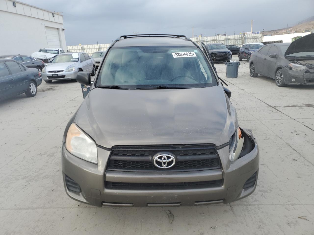 2012 Toyota RAV 4 VIN 2T3BF4DV7CW194028 Copart auction photo, side / front end damage thumbnail 5