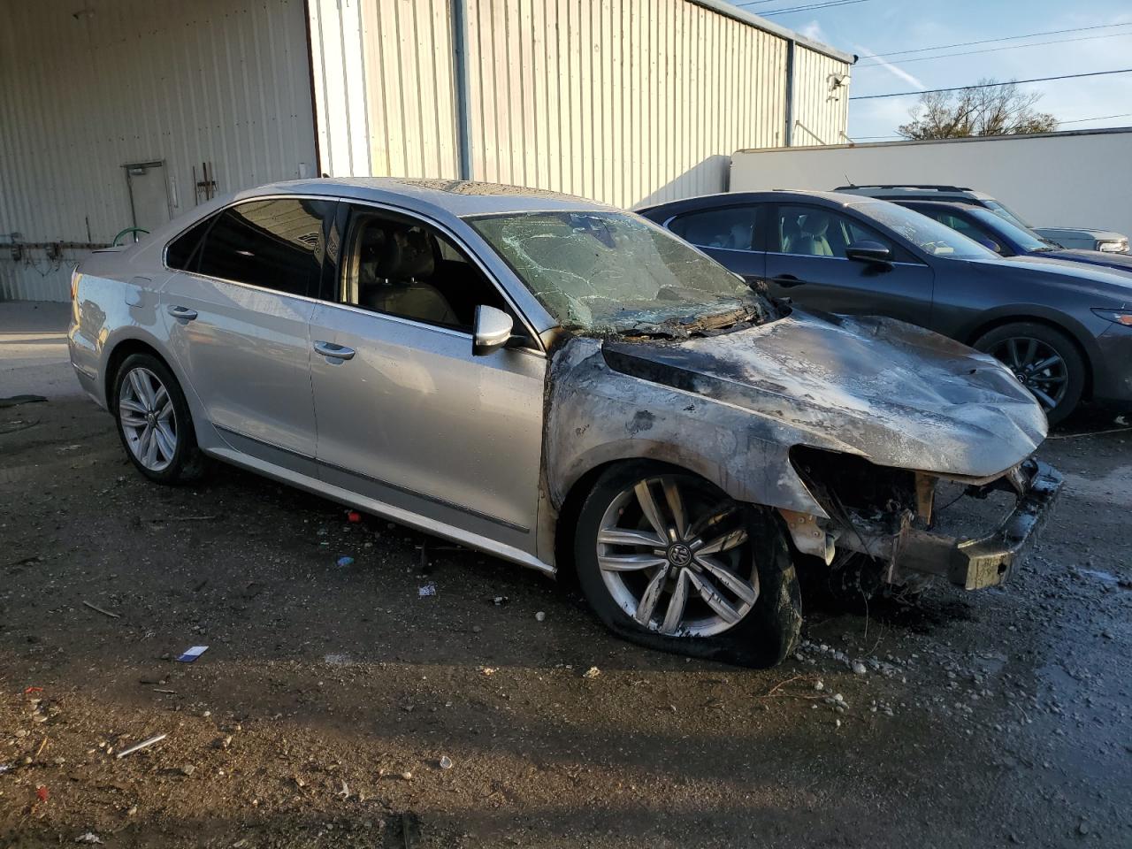 2017 Volkswagen Passat VIN 1VWCM7A39HC086581 Copart auction photo, burn damage thumbnail 4