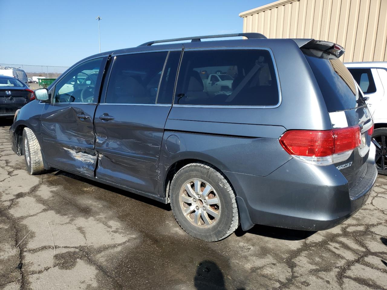 2010 Honda Odyssey VIN 5FNRL3H44AB007043 Copart auction photo, side / front end damage thumbnail 2