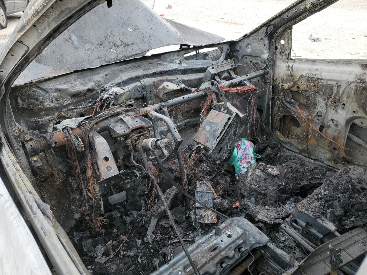2009 Toyota Yaris VIN JTDBT903794055243 Copart auction photo, burn damage thumbnail 8