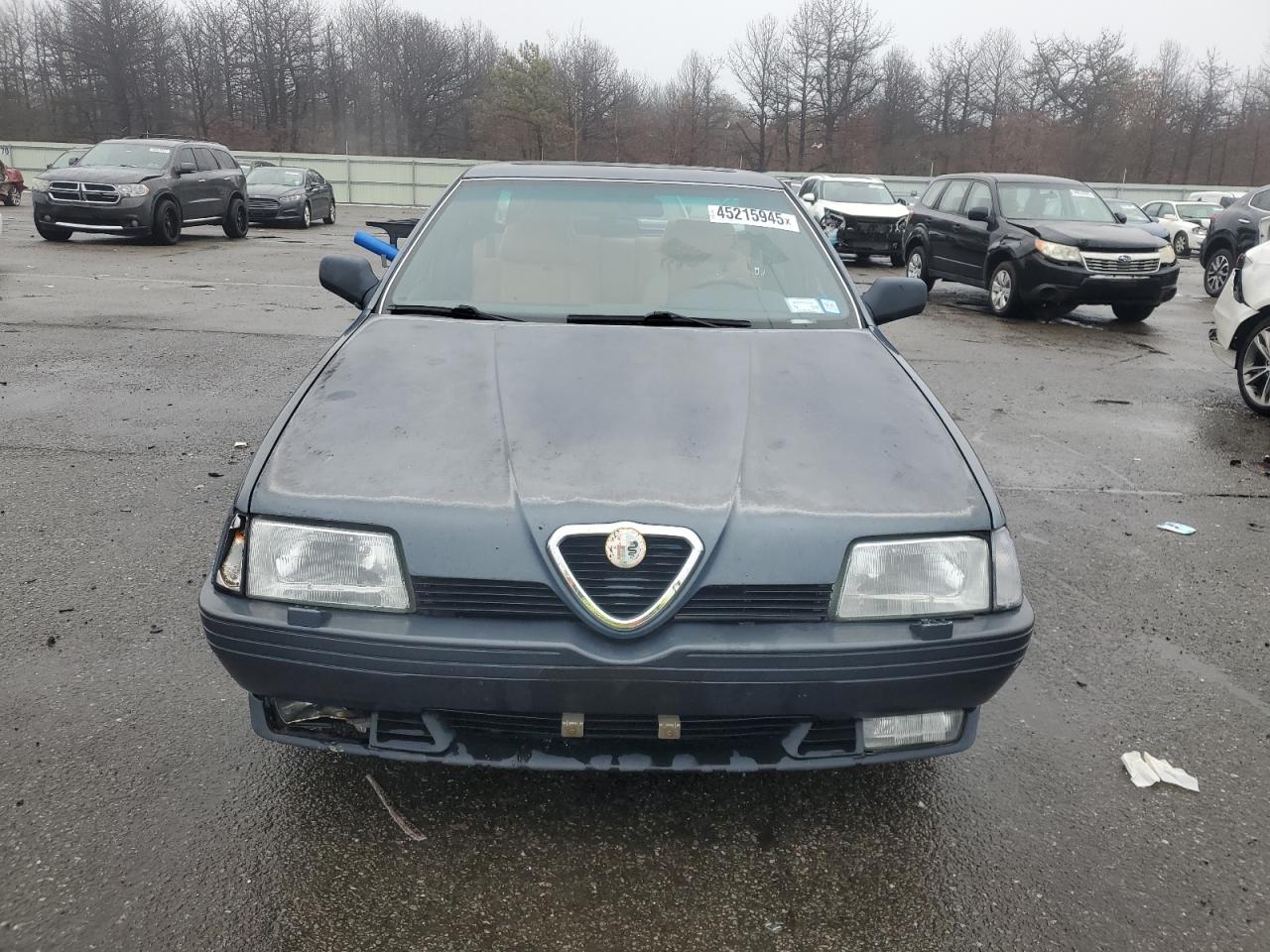1991 Alfa Romeo 164 VIN ZAREA43L5M6171139 Copart auction photo, rear end / minor dent/scratches damage thumbnail 5
