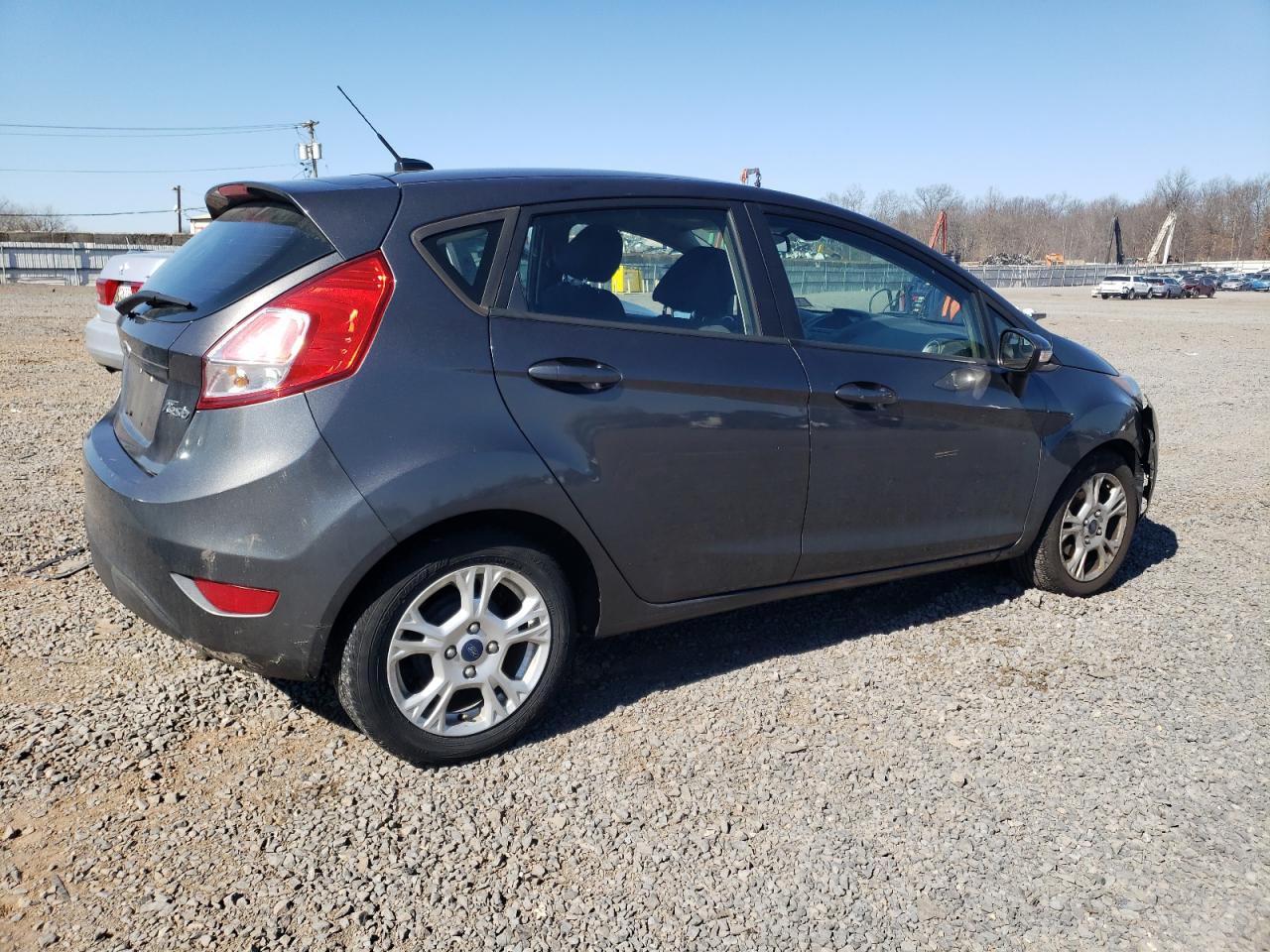 2015 Ford Fiesta VIN 3FADP4EJ9FM130148 Copart auction photo, all over damage thumbnail 3