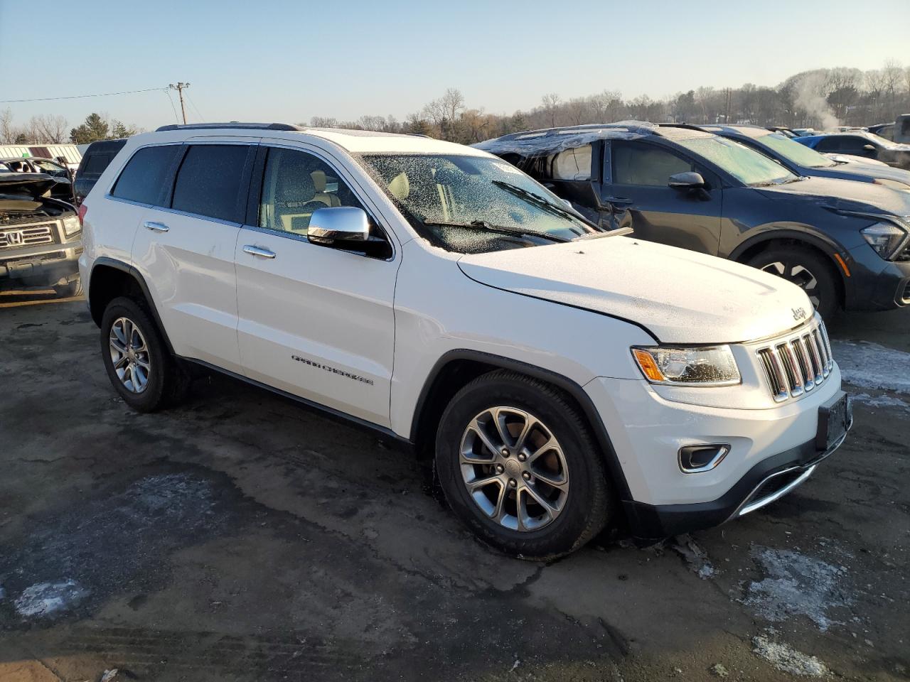 2015 Jeep Grand Cherokee VIN 1C4RJFBG0FC631999 Copart auction photo, front end / side damage thumbnail 4