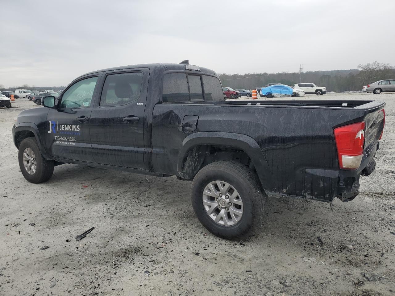2016 Toyota Tacoma VIN 3TMDZ5BNXGM002424 Copart auction photo, rear end damage thumbnail 2