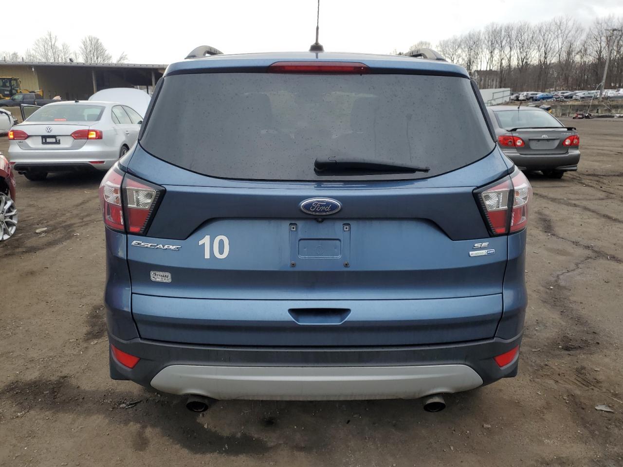 2018 Ford Escape VIN 1FMCU9GD2JUA74783 Copart auction photo, all over damage thumbnail 6