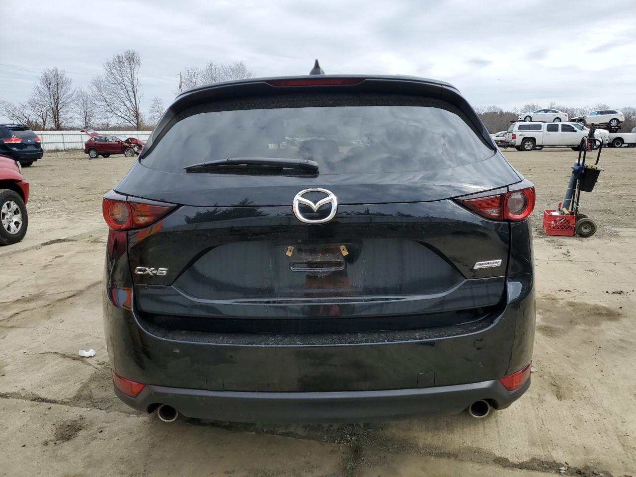 2017 Mazda CX-5 VIN JM3KFACLXH0195725 Copart auction photo, side / front end damage thumbnail 6