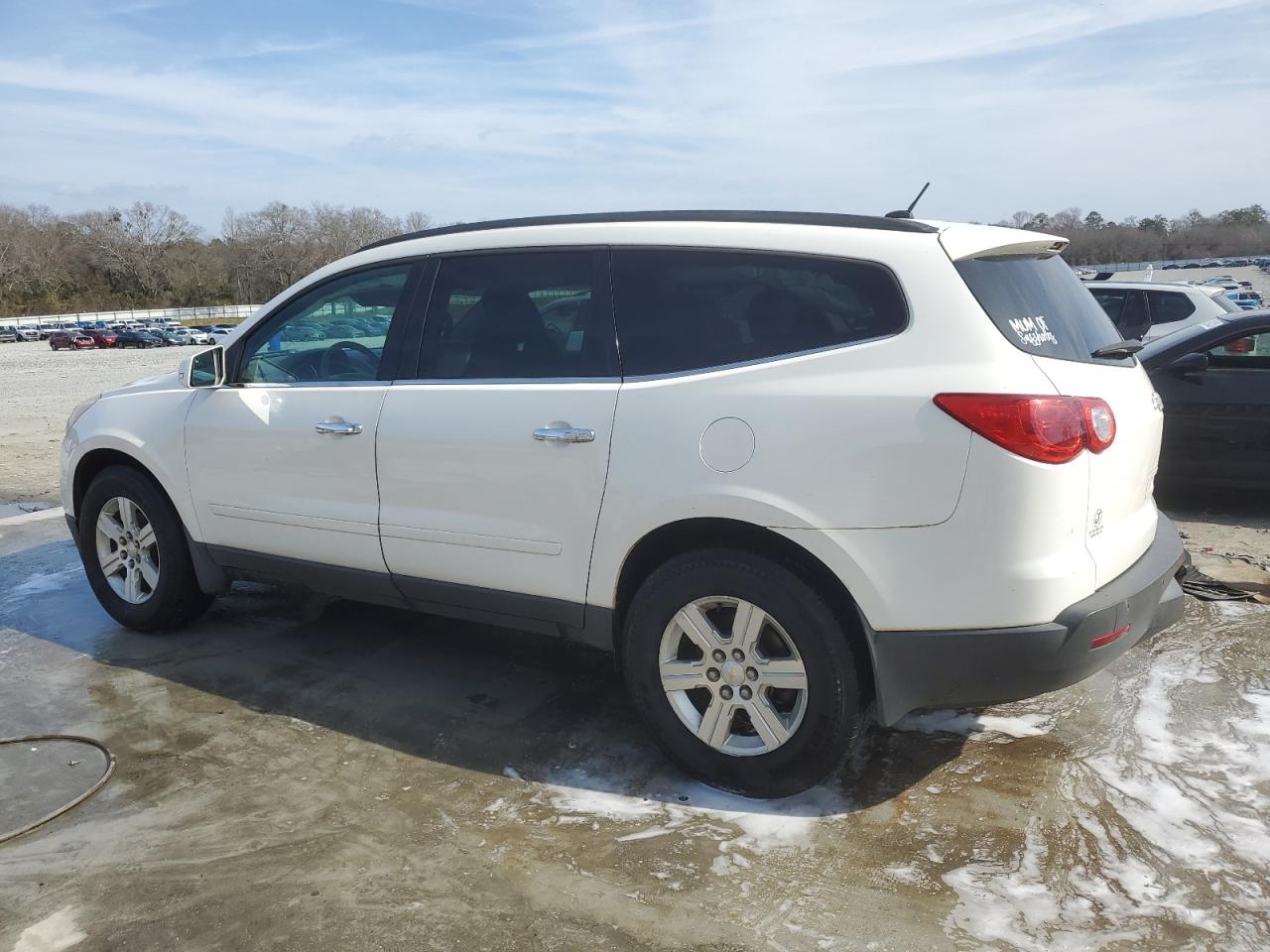 2012 Chevrolet Traverse VIN 1GNKRGED0CJ173882 Copart auction photo, side / front end damage thumbnail 2