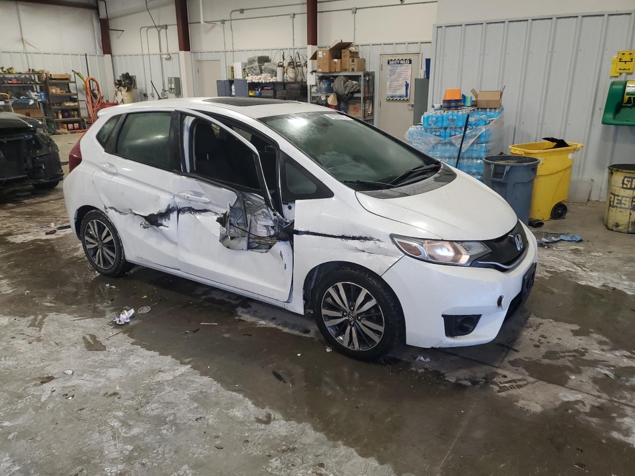 2015 Honda Fit VIN 3HGGK5H8XFM739626 Copart auction photo, side / front end damage thumbnail 4