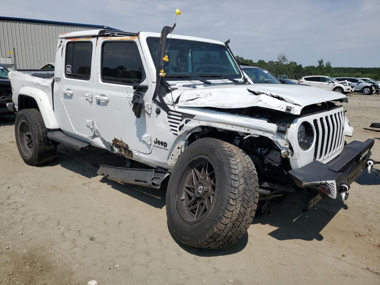 2021 Jeep Gladiator VIN 1C6HJTFG2ML571605 Copart auction photo, all over damage thumbnail 4
