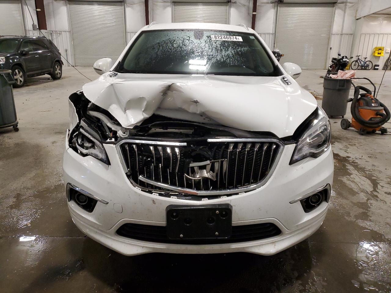 2017 Buick Envision VIN LRBFXDSA2HD198022 Copart auction photo, front end / side damage thumbnail 5