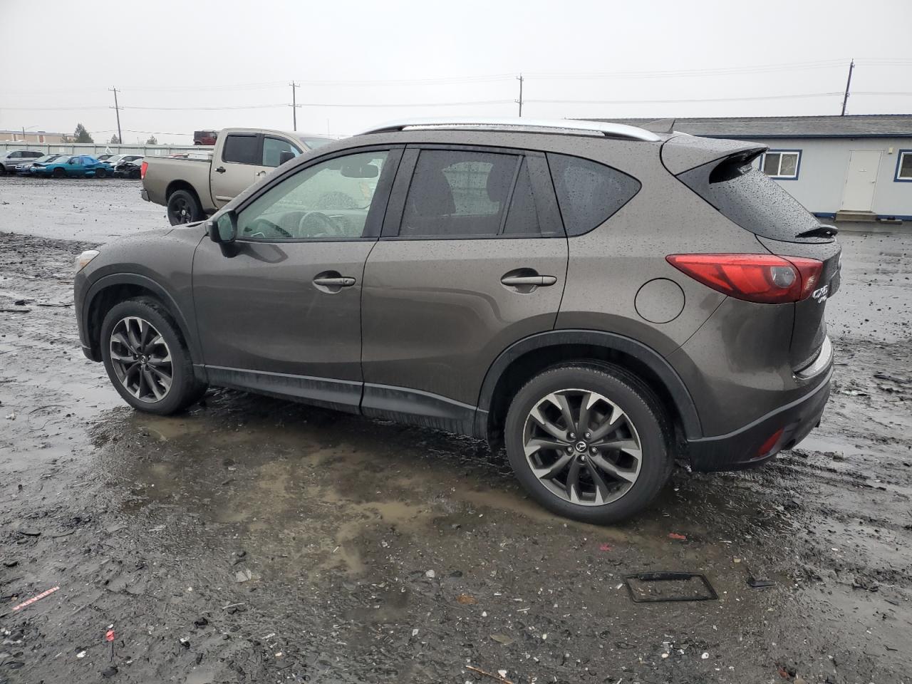 2016 Mazda CX-5 VIN JM3KE4DY8G0860313 Copart auction photo, side damage thumbnail 2