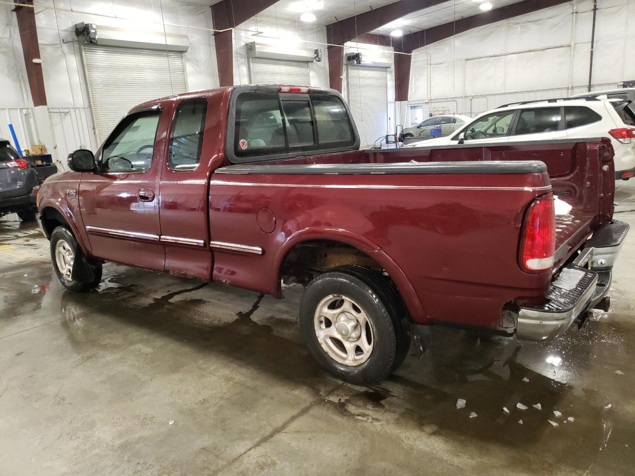 1997 Ford F-150 VIN 1FTDX1868VKA21749 Copart auction photo, rear end / side damage thumbnail 2