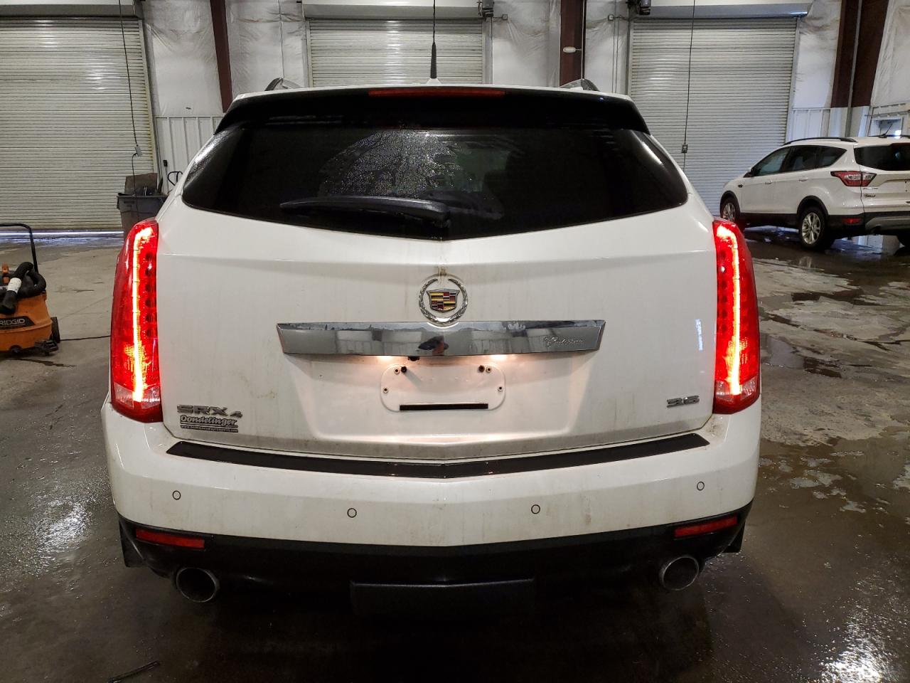 2014 Cadillac SRX VIN 3GYFNGE36ES581361 Copart auction photo, front end / rear end damage thumbnail 6