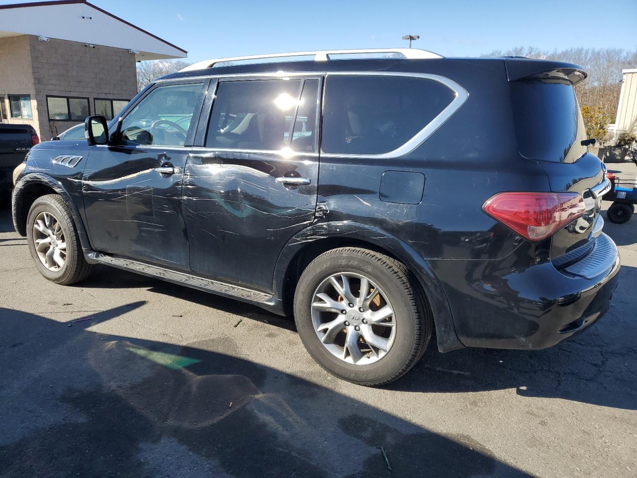 2011 Infiniti QX56 VIN JN8AZ2NC4B9303181 Copart auction photo, side / front end damage thumbnail 2