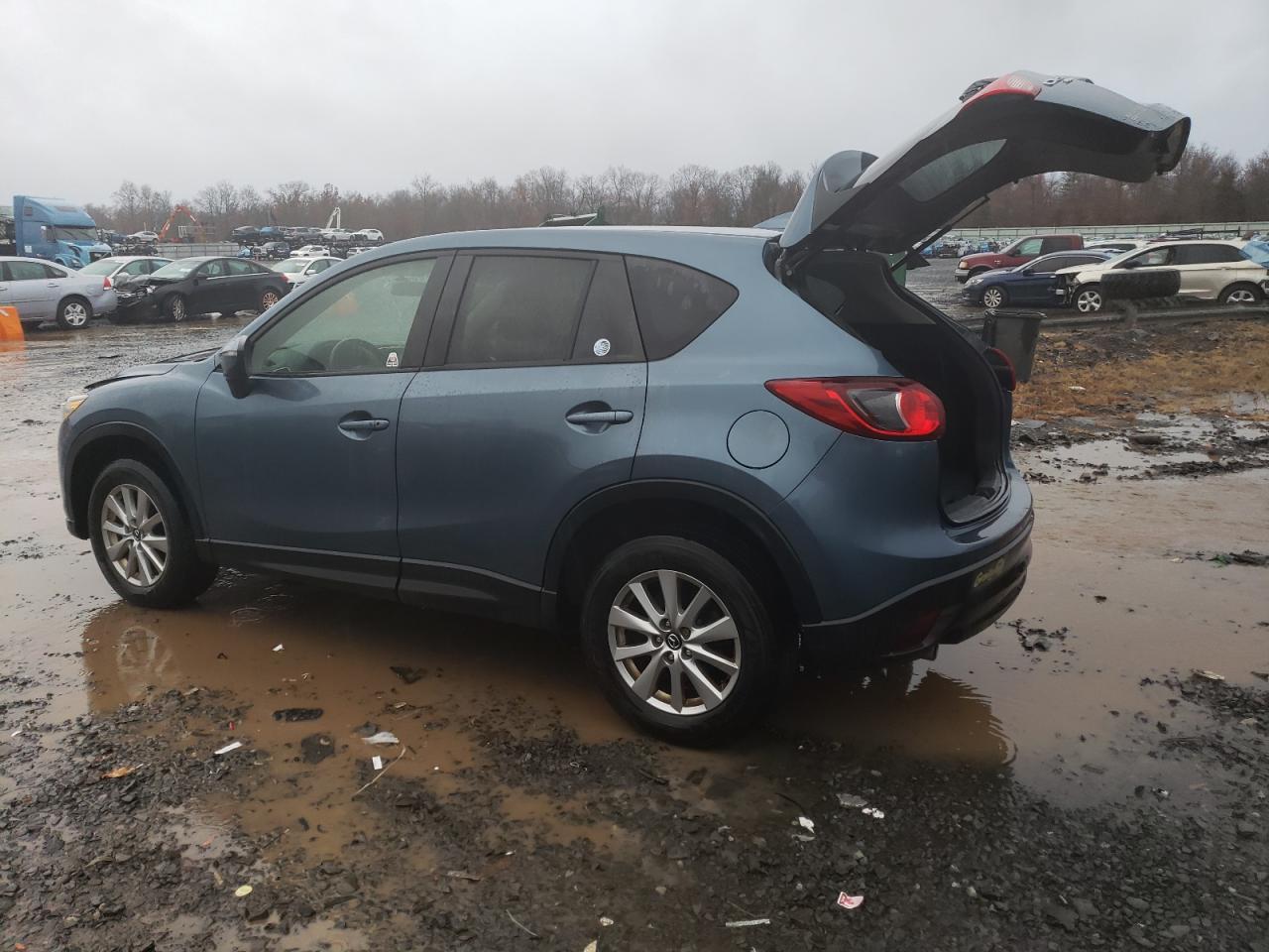 2016 Mazda CX-5 VIN JM3KE4CY4G0625666 Copart auction photo, side / front end damage thumbnail 2