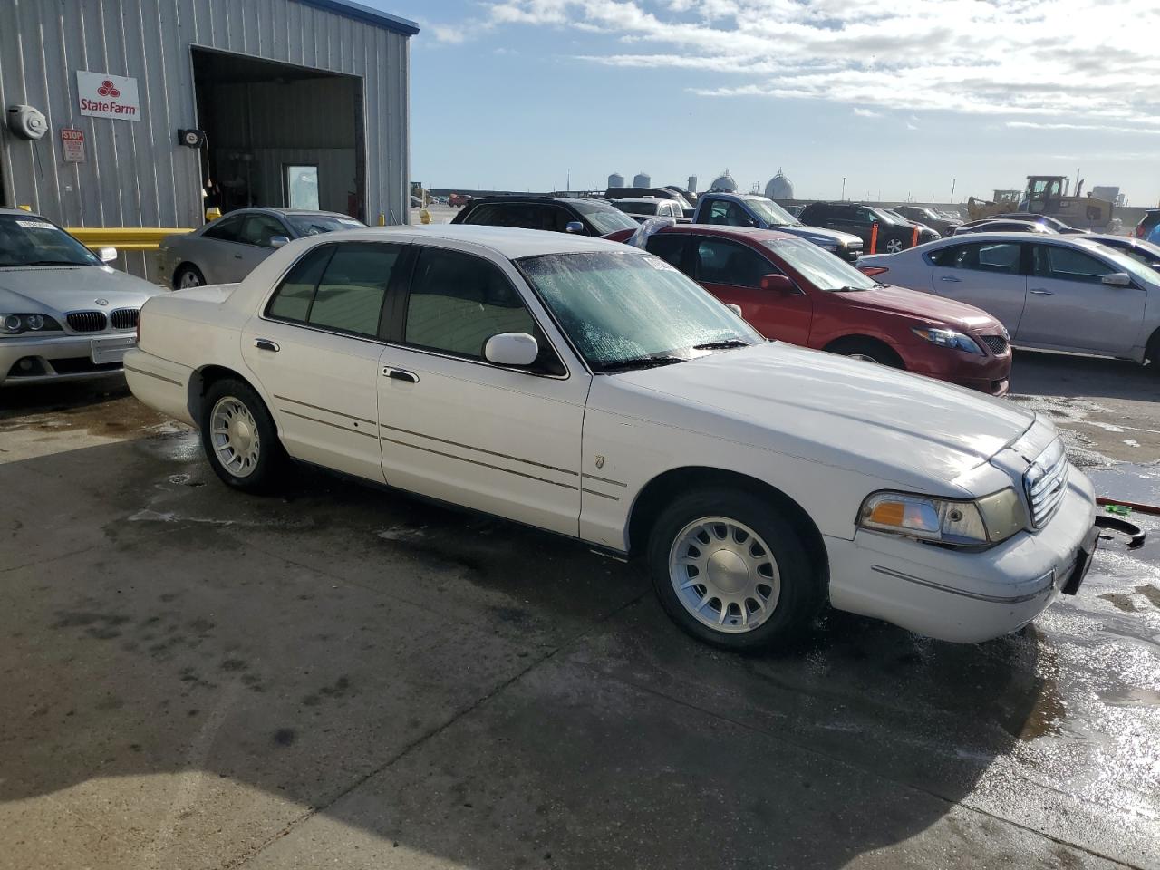 1999 Ford Crown Victoria VIN 2FAFP74W1XX224750 Copart auction photo, front end damage thumbnail 4