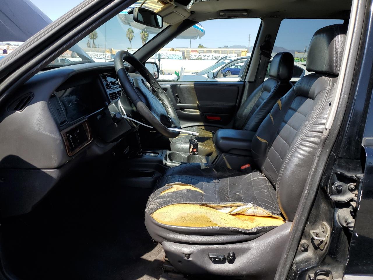 1998 Jeep Grand Cherokee VIN 1J4FX58S3WC144586 Copart auction photo, side / minor dent/scratches damage thumbnail 7