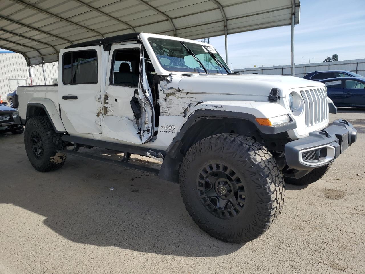 2021 Jeep Gladiator VIN 1C6HJTFG8ML511828 Copart auction photo, side damage thumbnail 4