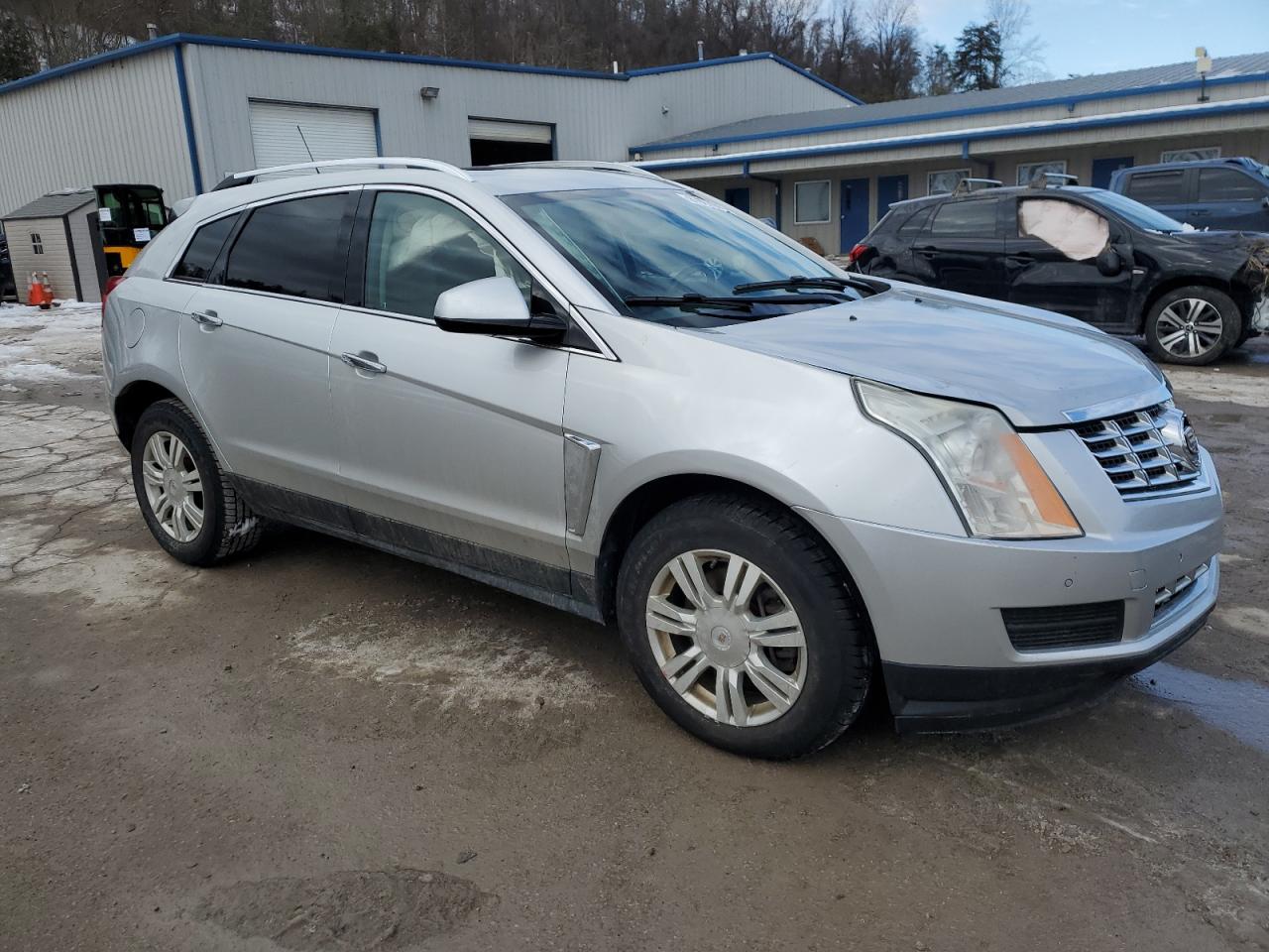 2015 Cadillac SRX VIN 3GYFNEE31FS580611 Copart auction photo, side / front end damage thumbnail 4