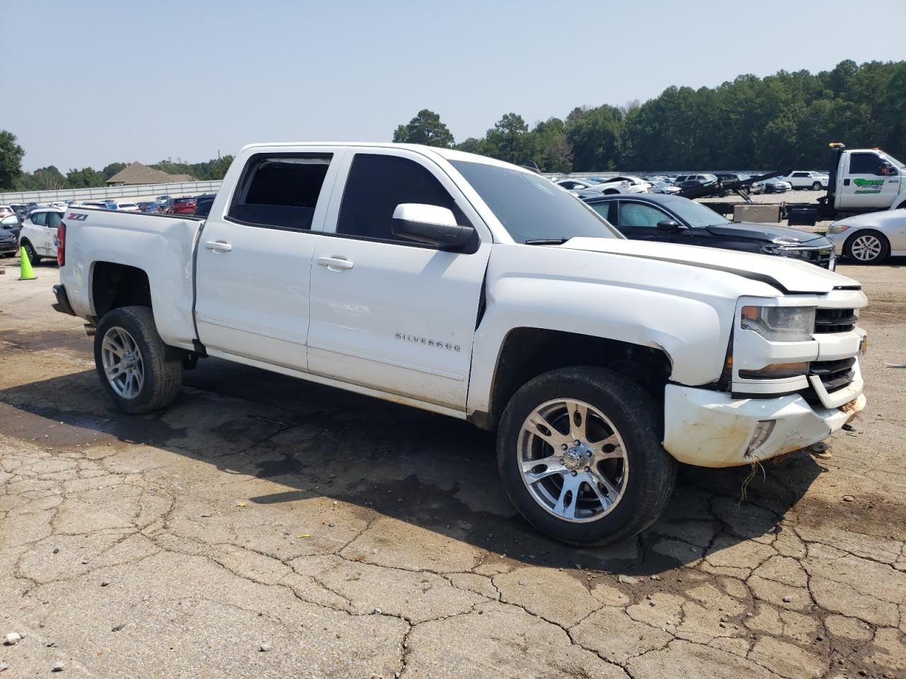 2016 Chevrolet Silverado VIN 3GCUKREC0GG220621 Copart auction photo, front end / side damage thumbnail 4