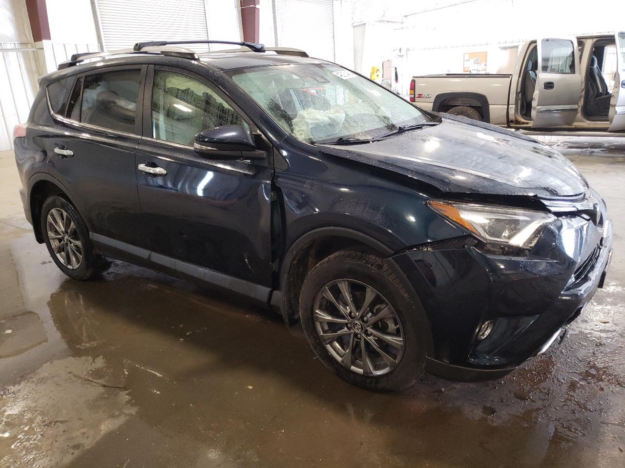 2018 Toyota RAV 4 VIN JTMDFREV3JJ200567 Copart auction photo, front end / side damage thumbnail 4