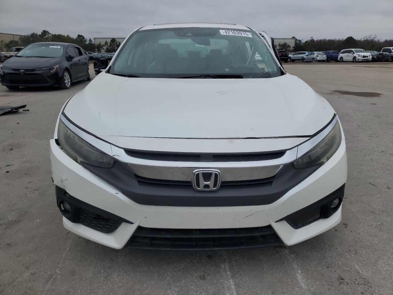 2016 Honda Civic VIN 19XFC1F94GE002980 Copart auction photo, all over damage thumbnail 5