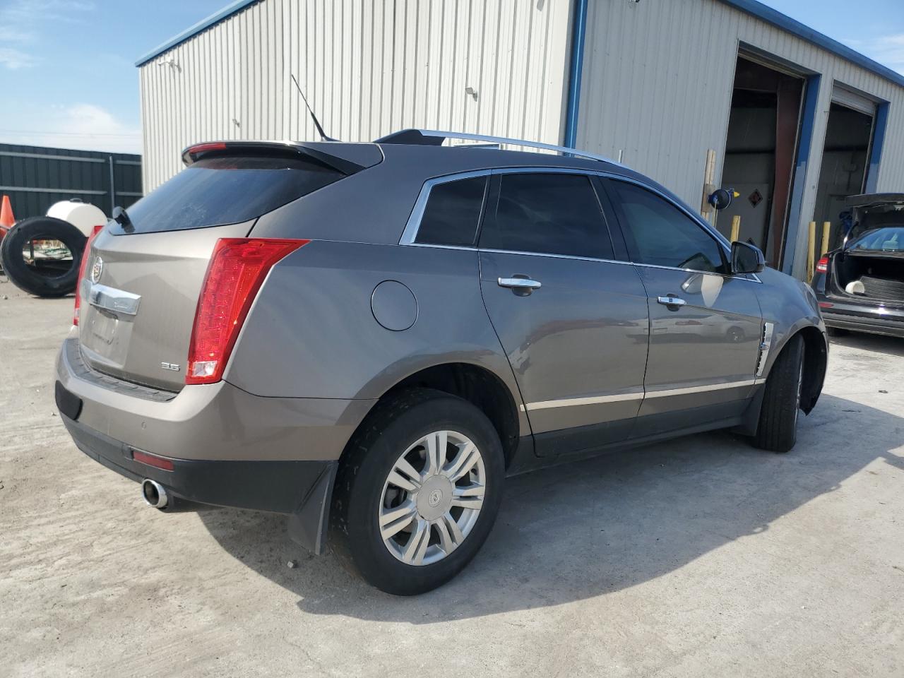2012 Cadillac SRX VIN 3GYFNAE33CS630865 Copart auction photo, front end / side damage thumbnail 3