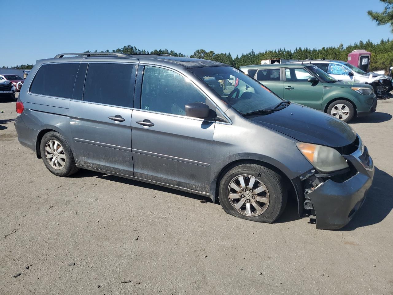 2010 Honda Odyssey VIN 5FNRL3H77AB100634 Copart auction photo, all over damage thumbnail 4