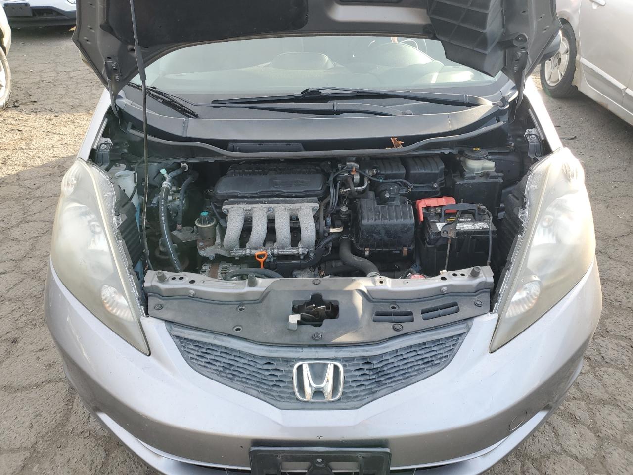 2010 Honda Fit VIN JHMGE8H29AS026704 Copart auction photo, side damage thumbnail 11