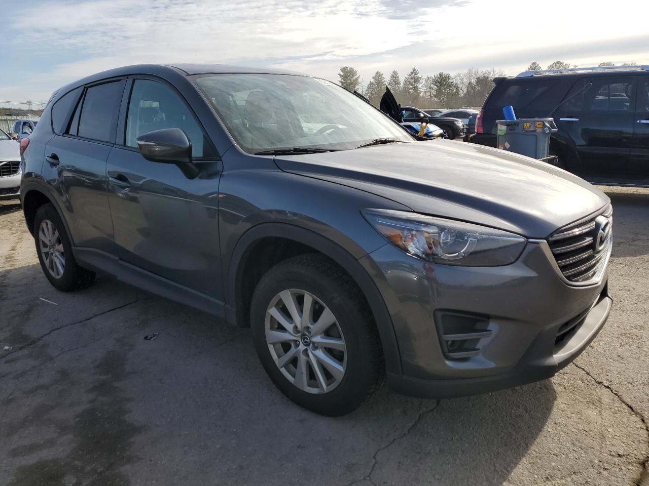 2016 Mazda CX-5 VIN JM3KE4CY8G0681660 Copart auction photo, rear end / side damage thumbnail 4