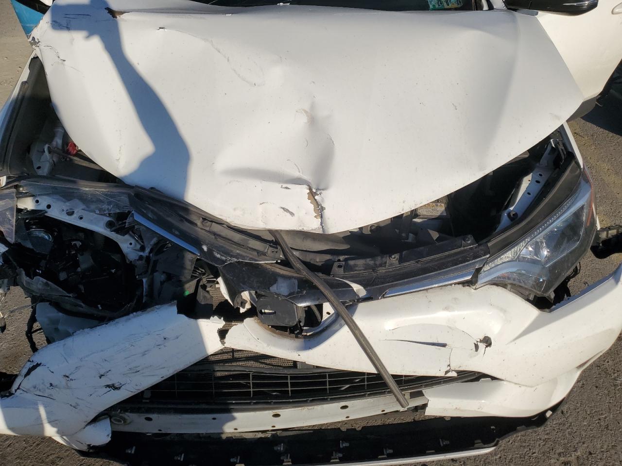 2018 Toyota RAV 4 VIN JTMRFREV8JJ734749 Copart auction photo, front end / side damage thumbnail 12