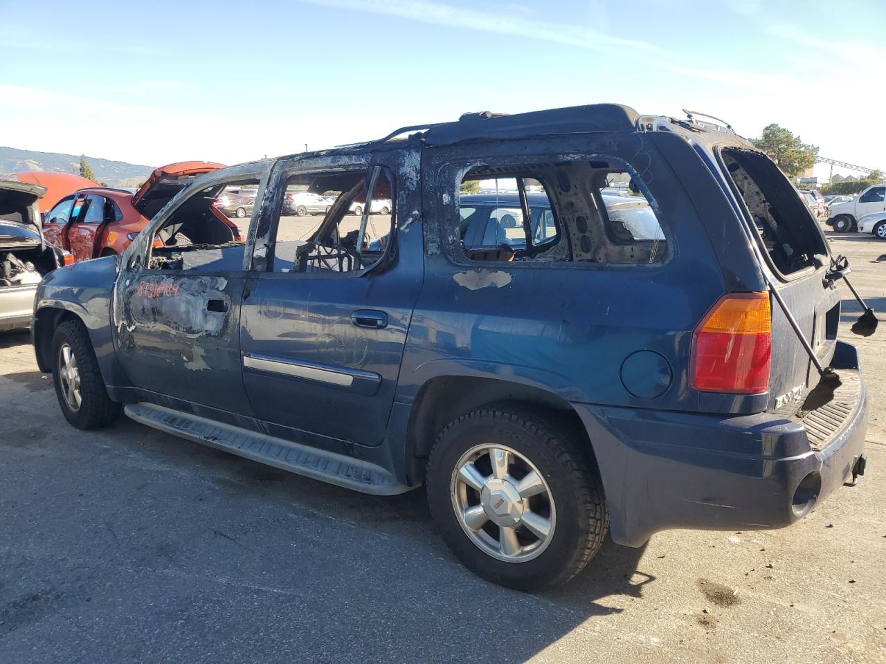 2004 GMC Envoy VIN 1GKES16S246236610 Copart auction photo, burn damage thumbnail 2