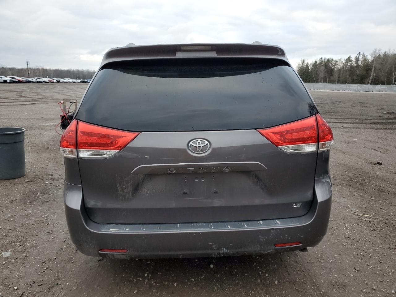2012 Toyota Sienna VIN 5TDKK3DC1CS217003 Copart auction photo, burn damage thumbnail 6