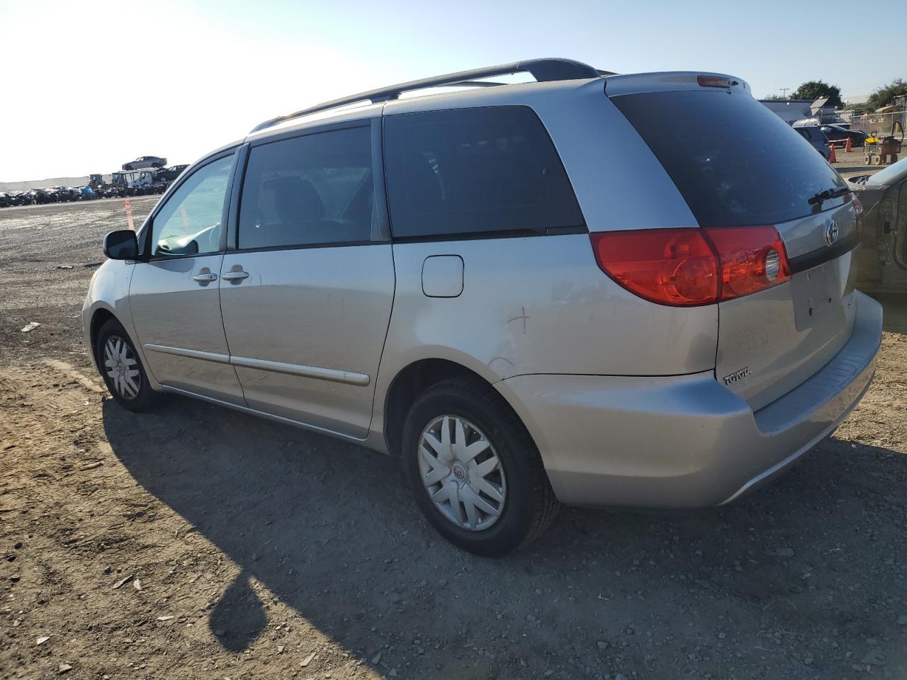 2010 Toyota Sienna VIN 5TDKK4CC0AS335855 Copart auction photo, side / front end damage thumbnail 2