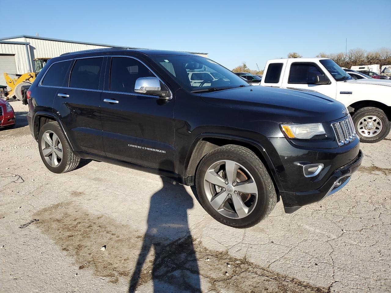 2015 Jeep Grand Cherokee VIN 1C4RJFCG3FC130572 Copart auction photo, front end / side damage thumbnail 4