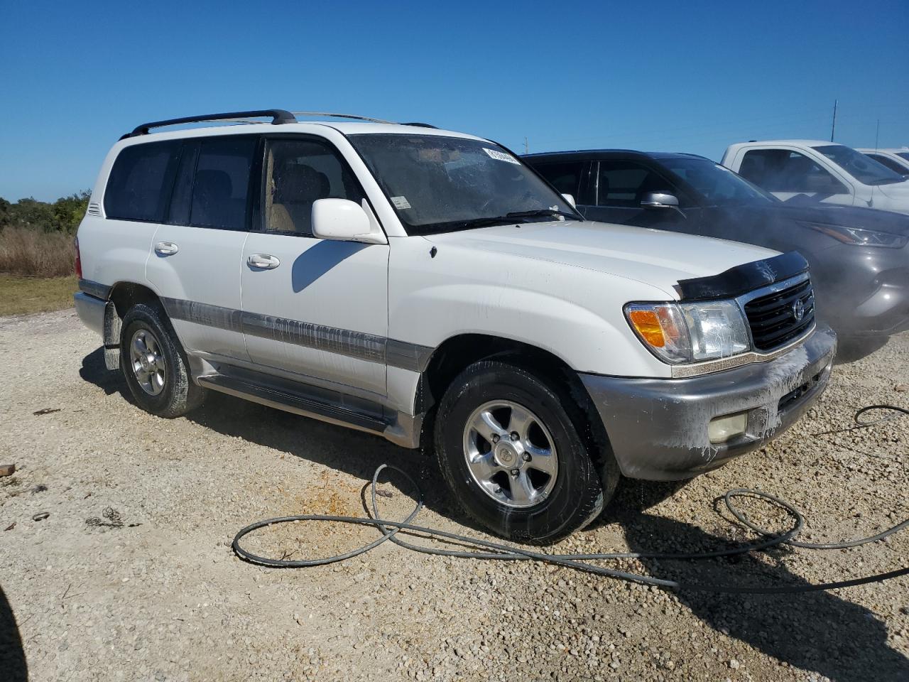 2001 Toyota Land Cruiser VIN JTEHT05J912001418 Copart auction photo, water/flood damage thumbnail 4