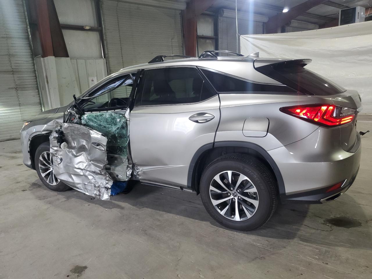 2020 Lexus RX VIN 2T2HZMDA0LC236883 Copart auction photo, side damage thumbnail 2